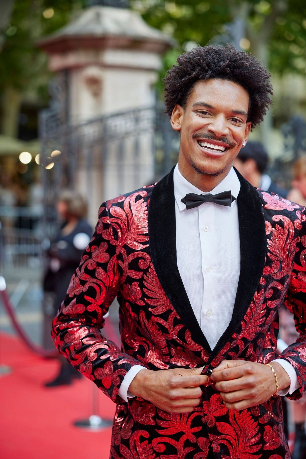 Guest smiling on the red carpet